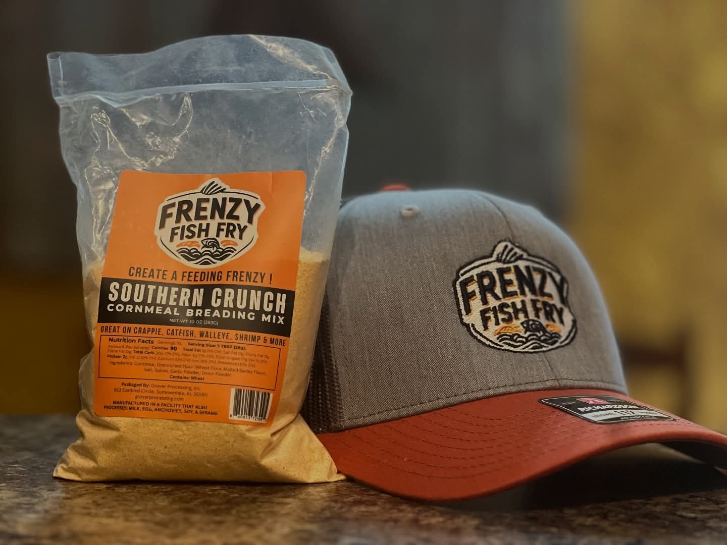 Bag of Frenzy Fish Fry Southern Crunch breading mix with Frenzy branded hat – perfect for frying fish, chicken, or vegetables