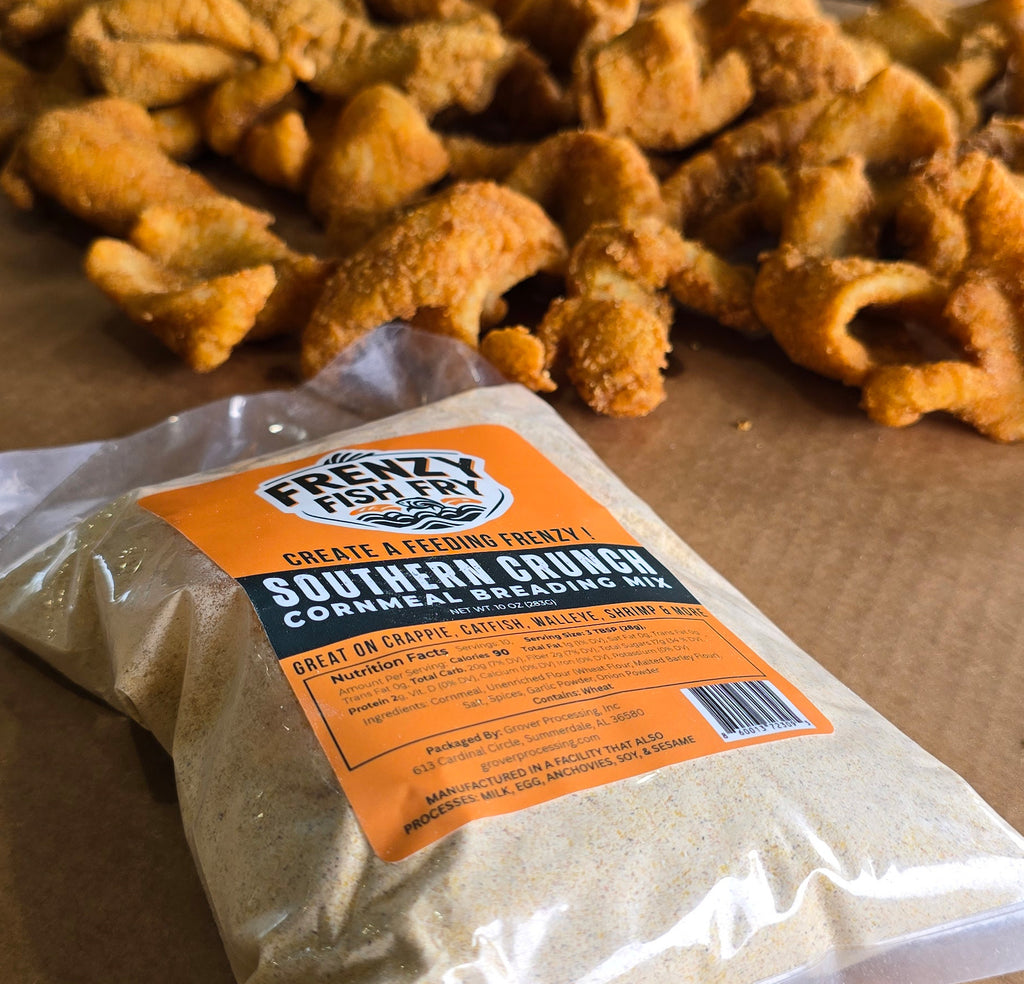 Southern Crunch Fish Fry Mix 10oz bag by Frenzy Fish Fry with golden fried fish in the background, showing crispy Southern-style cornmeal breading results.